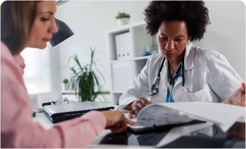 A doctor showing exam results to a woman