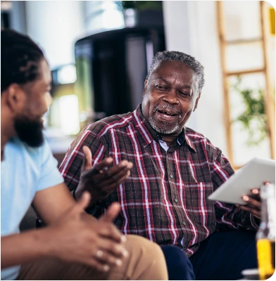 Elderly guy explaining something to its son